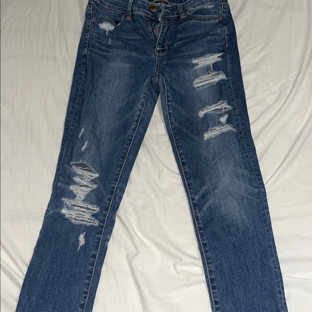 slightly ripped blue jeans